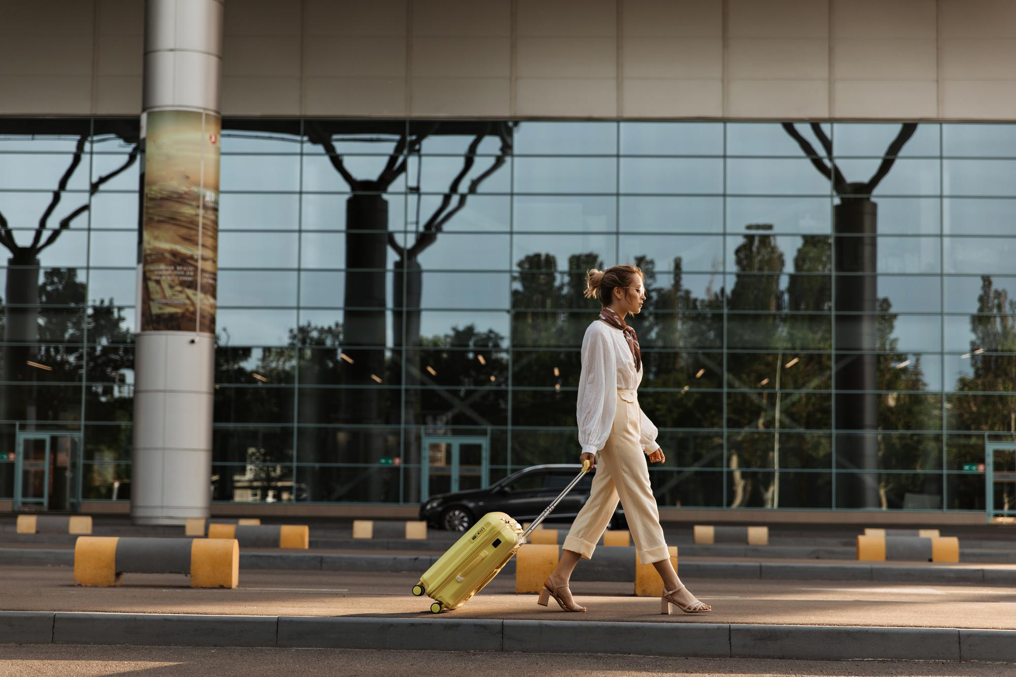 Traveller walking with suitcase at airport